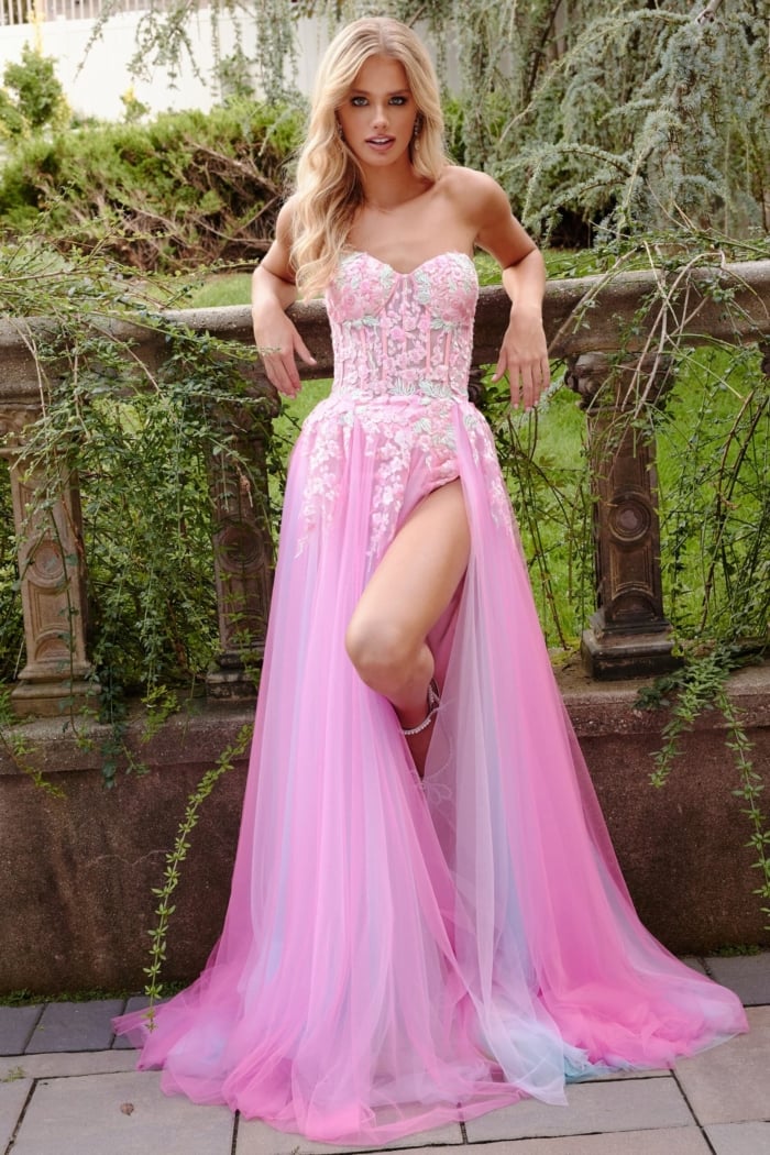 Model wearing Jovani 23713 pink gown, highlighting the embroidered floral design.