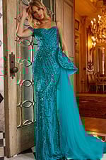Model showcasing Jovani 23777 blue off-the-shoulder gown with sequins in an elegant pose from the front.