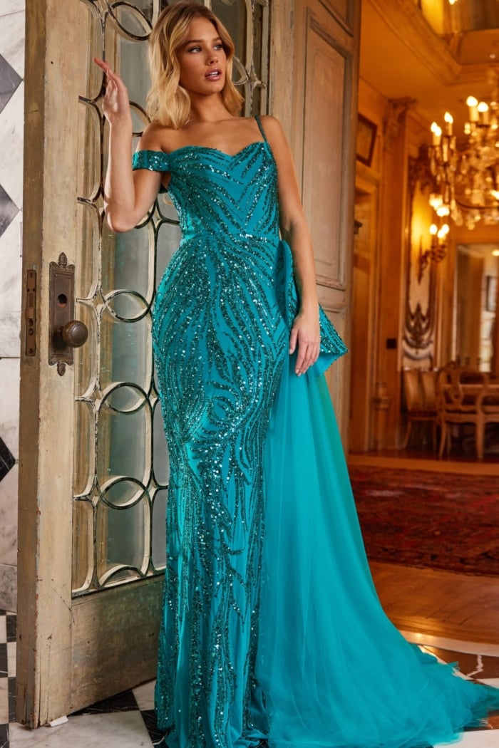 Model in Jovani 23777 blue off-the-shoulder gown, showing off the sequins and romantic design from the front.