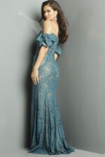 Back view of model in Jovani 23813 navy gown with lace details