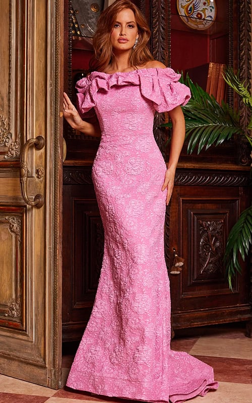 Model wearing Jovani 23847 pink lace dress with ruffled off-the-shoulder neckline