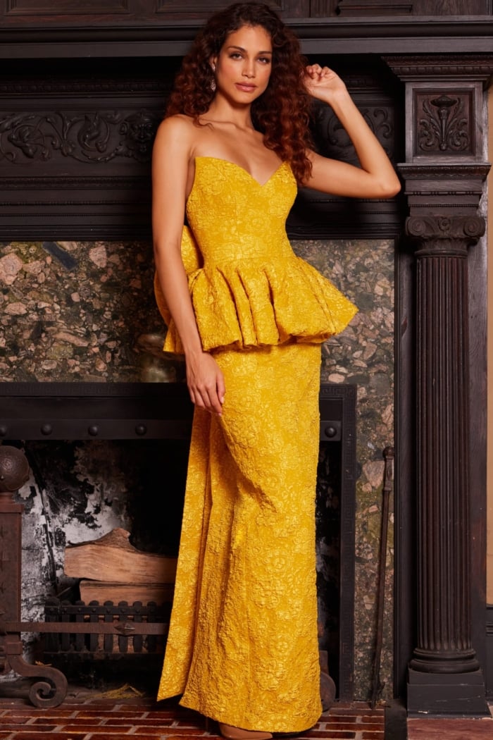 Model in Jovani 23849 yellow gown with sweetheart neckline.