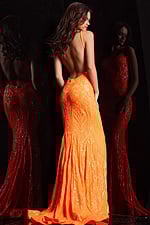 Model showing Jovani 23852 orange gown with open back