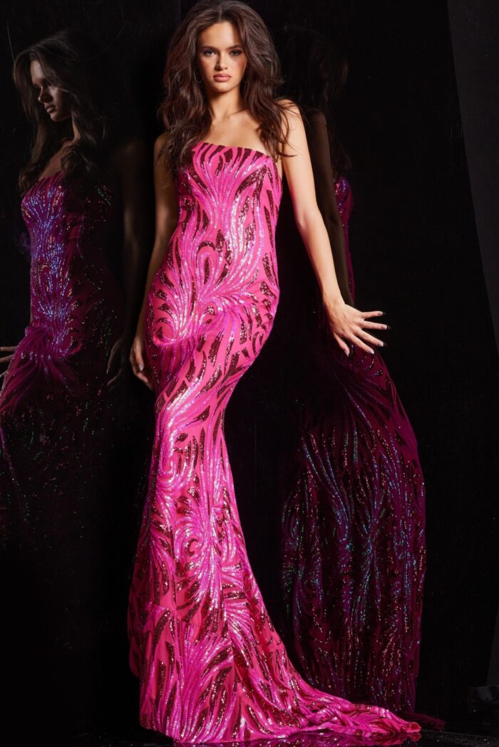 Model wearing Jovani 23876 in pink, front view with a mermaid silhouette and strapless neckline.