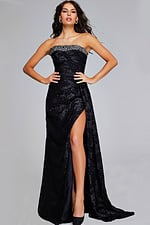 model in Jovani 23892 black gown front view with elegant beaded neckline