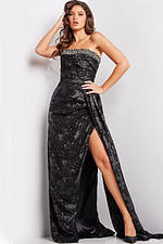 Model wearing Jovani 23892 long black dress with beaded neckline and front slit.