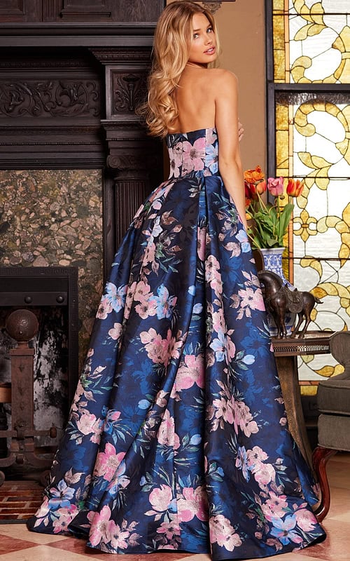 Model showing the back of Jovani 23893 strapless floral gown.