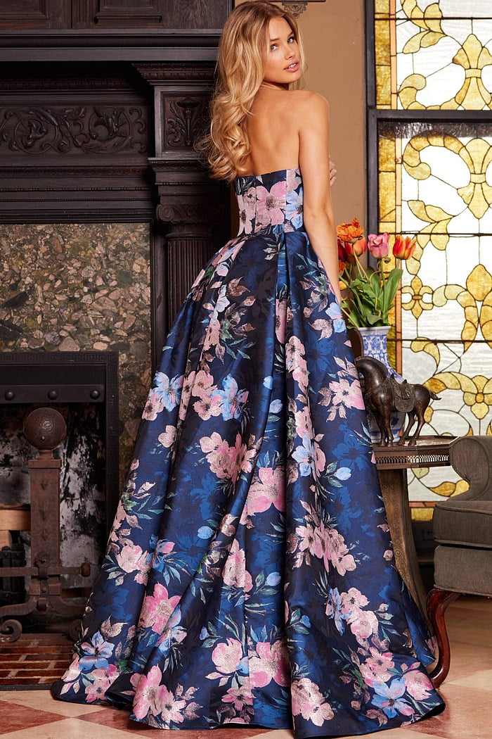Model showing the back of Jovani 23893 strapless floral gown.