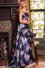 Model wearing Jovani 23893 strapless floral gown from an angled front view.