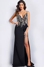 Model wearing Jovani 23938 black gown with sweetheart neckline and high slit