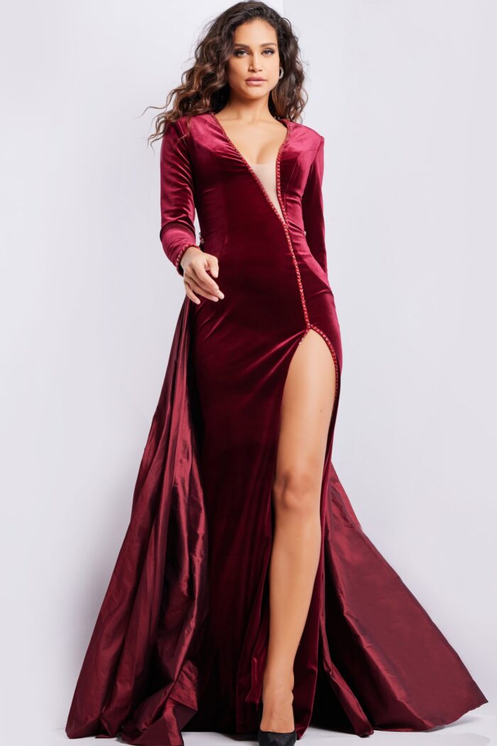 Model wearing Jovani 23943 burgundy gown, front view, showcasing the high slit and elegant silhouette.