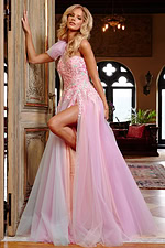 Side view of a model in Jovani 23951 pink dress with high slit and ruffled shoulder