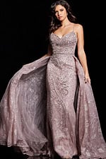 Model wearing Jovani 24001 taupe dress from the front view with flowing skirt.