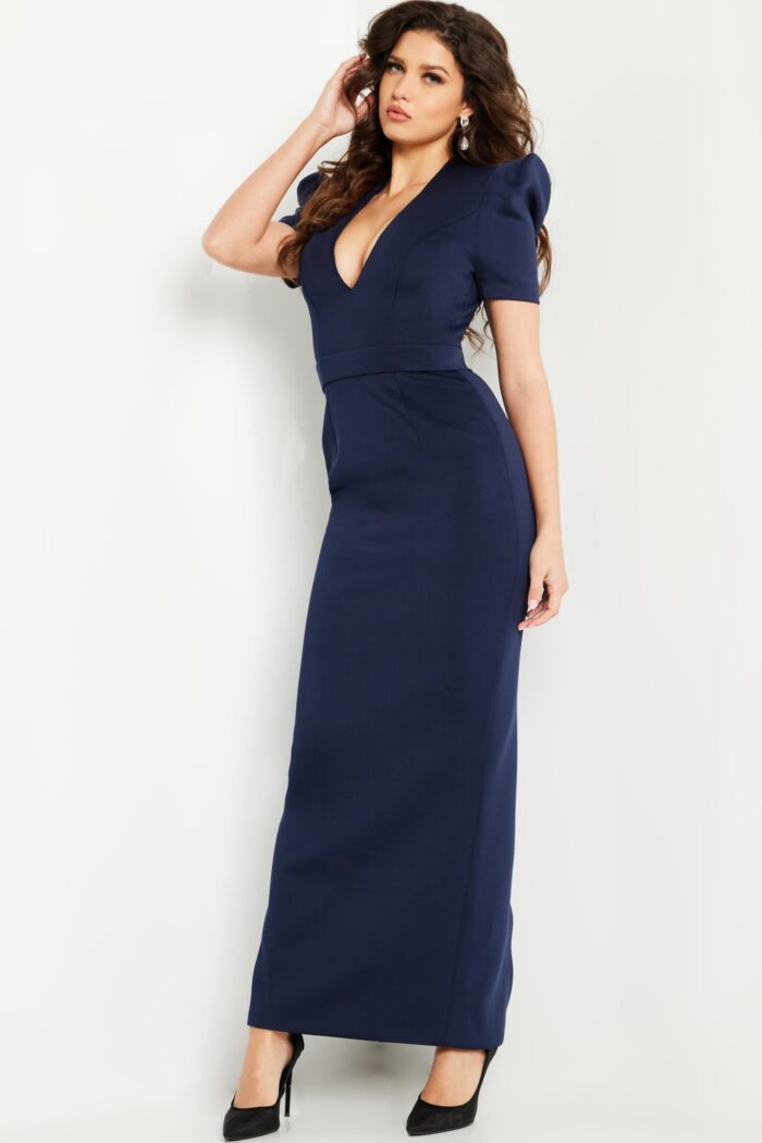 Model wearing Jovani 24021 navy dress showcasing fitted silhouette, side view.