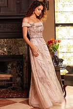 Model wearing Jovani 24055 beige gown, highlighting the embroidered bodice and off-the-shoulder neckline.