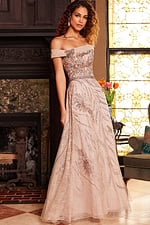 Model wearing Jovani 24055 beige floor-length dress with off-the-shoulder neckline and embroidery, front view.