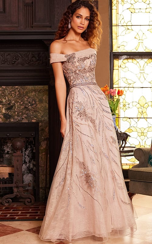 Model wearing Jovani 24055 beige floor-length dress with off-the-shoulder neckline and embroidery, front view.