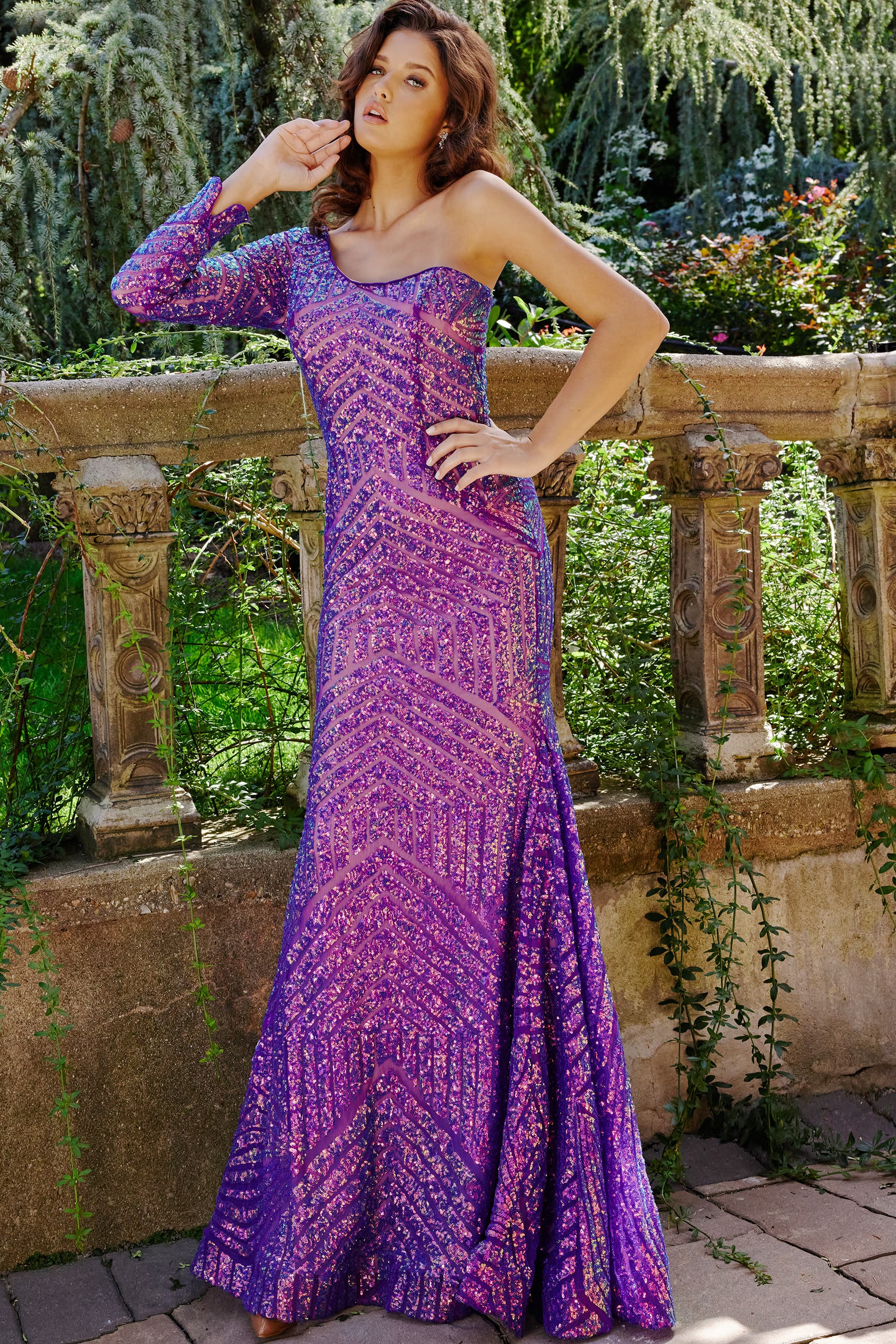 24098-5.jpg Model wearing Jovani 24098 lilac dress with long sleeve and one-shoulder