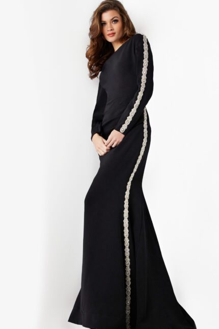 model wearing Jovani 24191: black mermaid gown with silver embellishment, front view