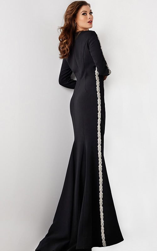 model wearing Jovani 24191: black mermaid gown with silver embellishment, back view