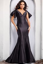 Model wearing Jovani 24193 black gown from the back, showcasing the elegant mermaid silhouette.