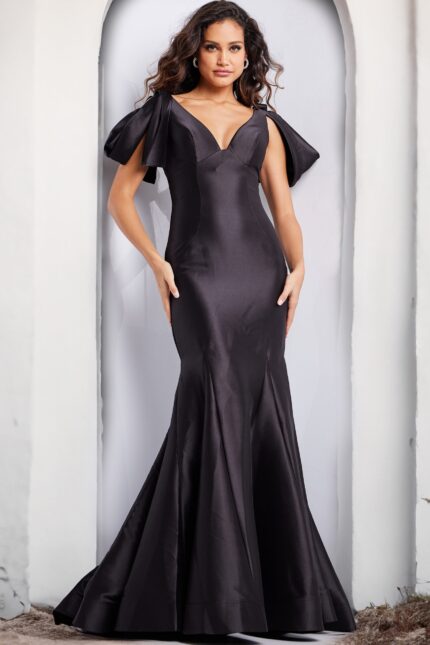 Model wearing Jovani 24193 black gown from the back, showcasing the elegant mermaid silhouette.