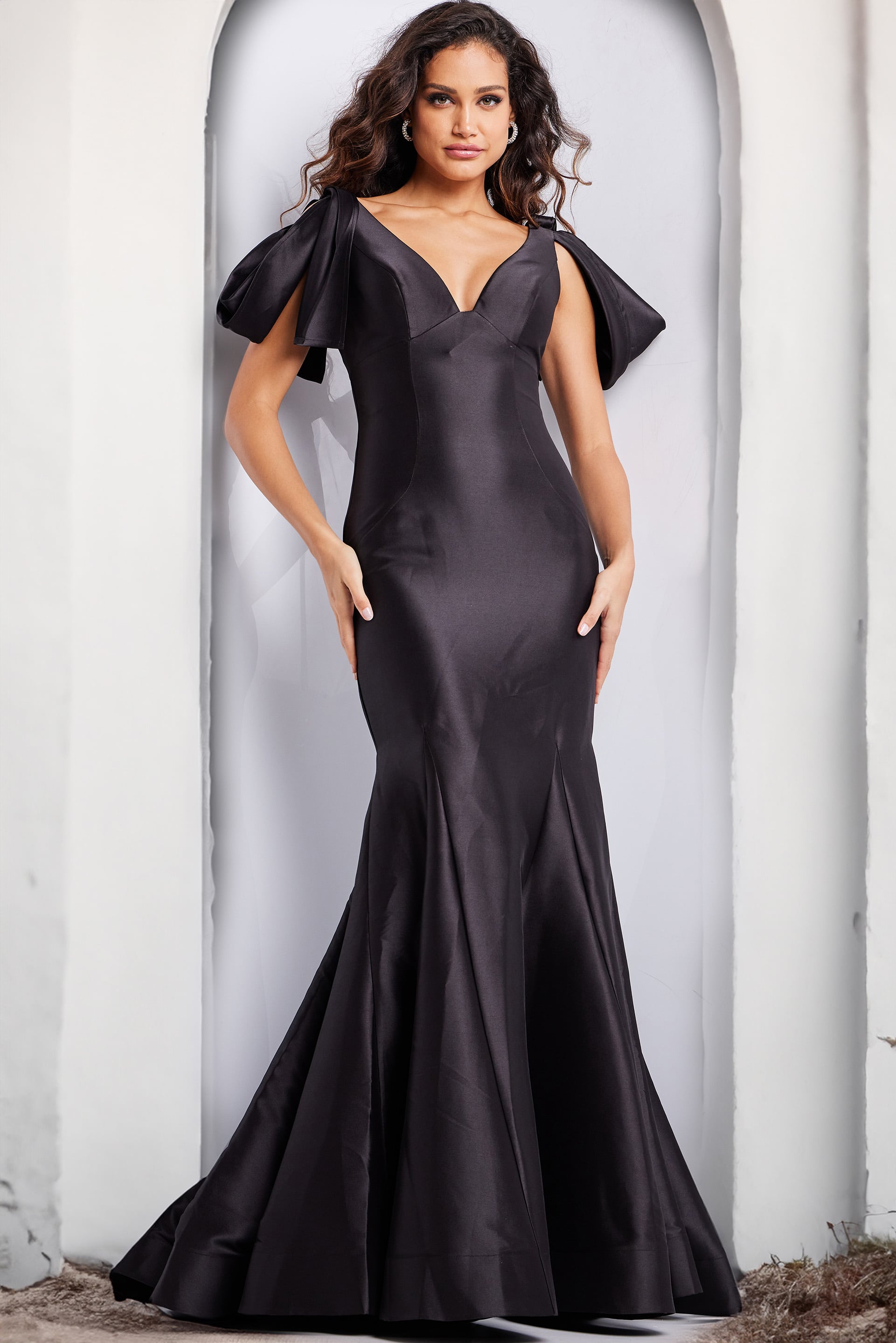 24193-black-2.jpg Model wearing Jovani 24193 black gown from the back, showcasing the elegant mermaid silhouette.