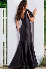 Model wearing Jovani 24193 black gown with V-neckline and mermaid silhouette.
