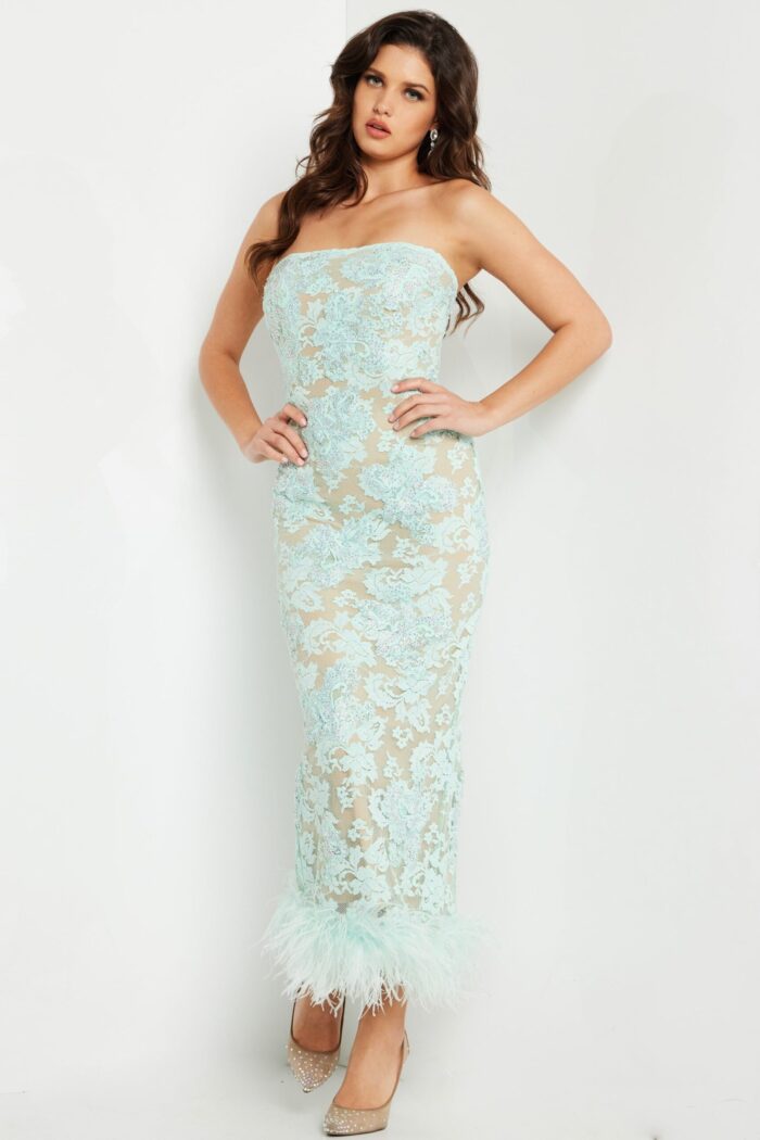 Model wearing Jovani 24256 aqua dress showcasing intricate lace and fitted design