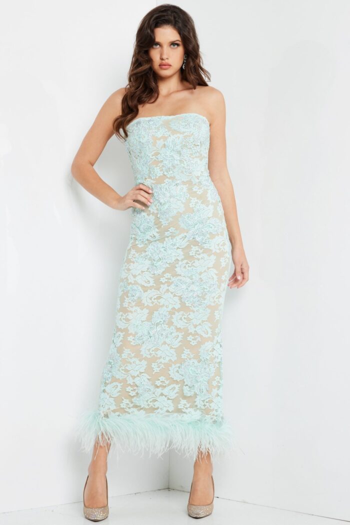 Model wearing Jovani 24256 elegant aqua dress with feather details at hem
