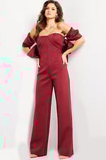 Model showcasing Jovani 24278 burgundy dress with elegant wide-leg fit.