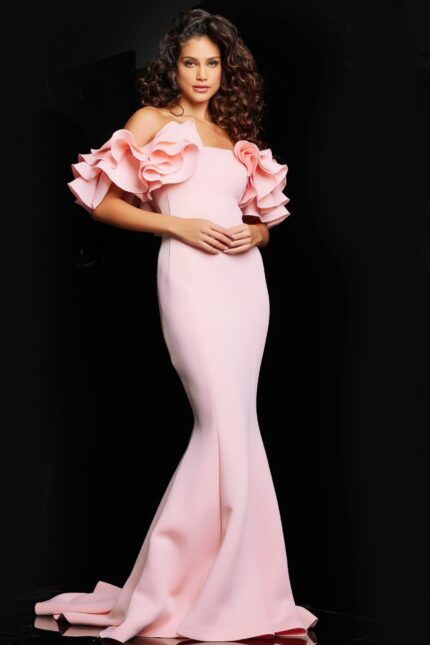 Model wearing Jovani 24280 blush evening gown with ruffled sleeves from the front.
