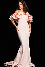 Model wearing Jovani 24280 blush evening gown with ruffled sleeves, facing forward.
