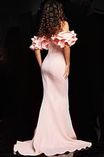 Back view of model wearing Jovani 24280 blush evening gown with ruffled sleeves.