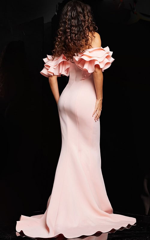 Back view of model wearing Jovani 24280 blush evening gown with ruffled sleeves.