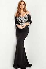 Model wearing Jovani 24328 black off-the-shoulder dress.