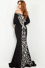 Model wearing Jovani 24328 black dress with back detailing.