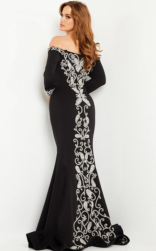 Model wearing Jovani 24328 black dress with back detailing.