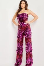 Model wearing Jovani 24527 fuchsia sequin jumpsuit with a strapless neckline and wide-leg pants.