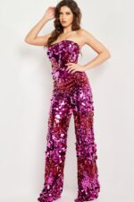 Model in Jovani 24527 fuchsia sequin jumpsuit, emphasizing glamorous strapless design.