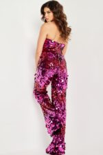 Back view of model in Jovani 24527 fuchsia sequin jumpsuit.
