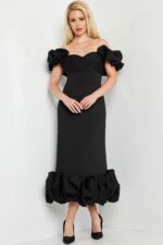 model wearing Jovani 24535 black dress with ruffled sleeves and hem, front view