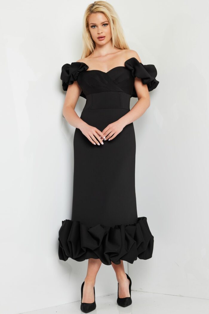 model wearing Jovani 24535 black dress with ruffled sleeves and hem, front view