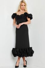 model wearing Jovani 24535 black dress, front view with ruffled details