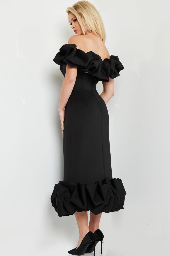 model wearing Jovani 24535 black dress with ruffled sleeves, back view