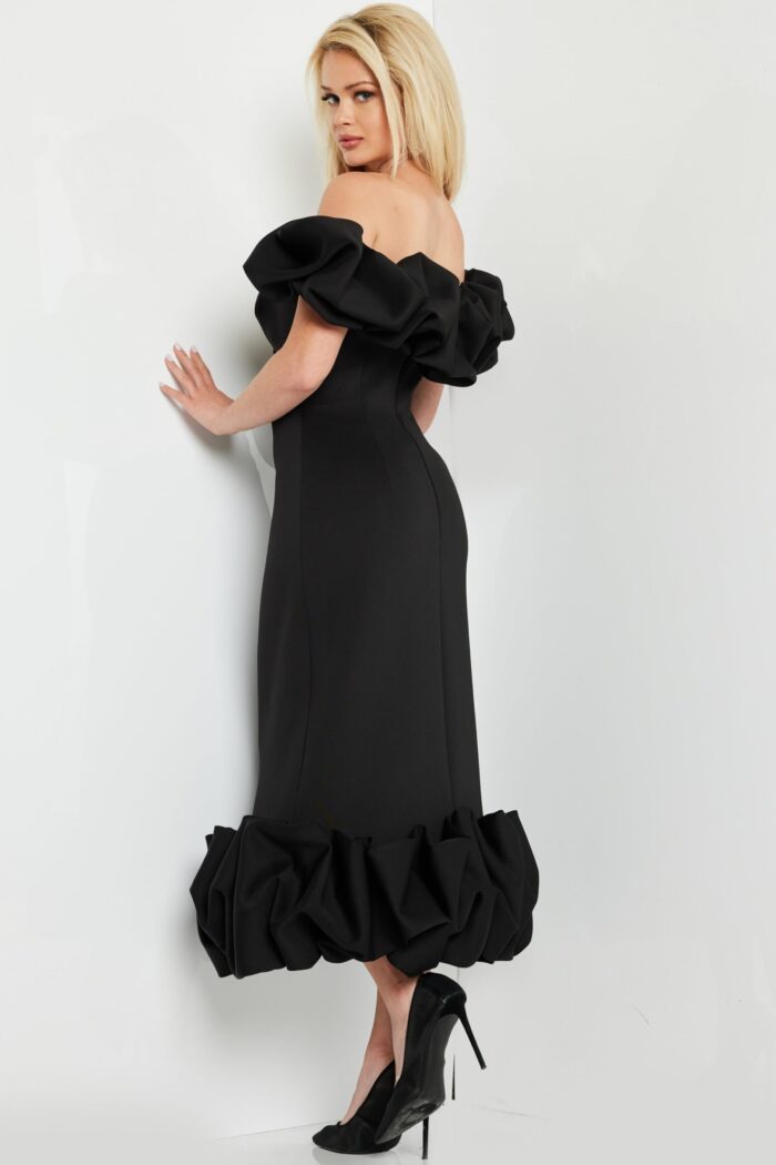 model wearing Jovani 24535 black dress, back view showcasing the silhouette and ruffles