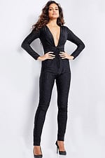 Model in Jovani 24537 black jumpsuit with deep V-neck and long sleeves