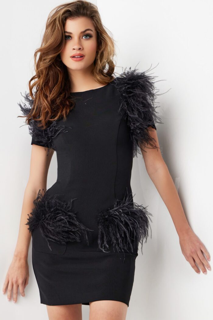 Model wearing Jovani 24558 black dress with front feathered design.