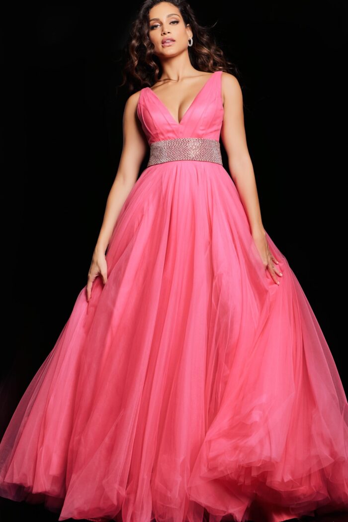 Model wearing Jovani 24564 hot pink gown, elegant floor-length silhouette with V-neck.
