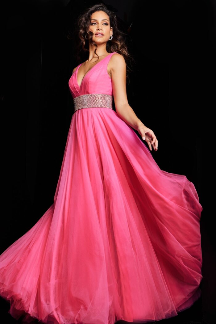 Model wearing Jovani 24564 hot pink gown, floating tulle fabric and embellished waist.